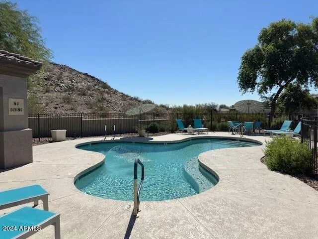 a view of a patio with swimming pool