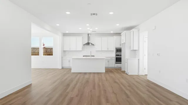 a view of kitchen with wooden floor