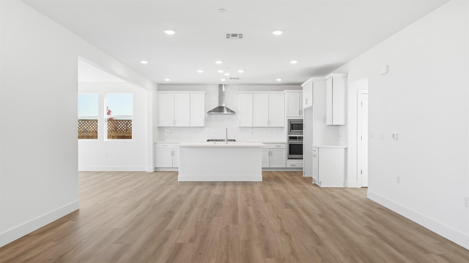 787 Lorca Street Mountain House, CA 95391 - Photo 12 of 36 a view of kitchen with wooden floor and electronic appliances