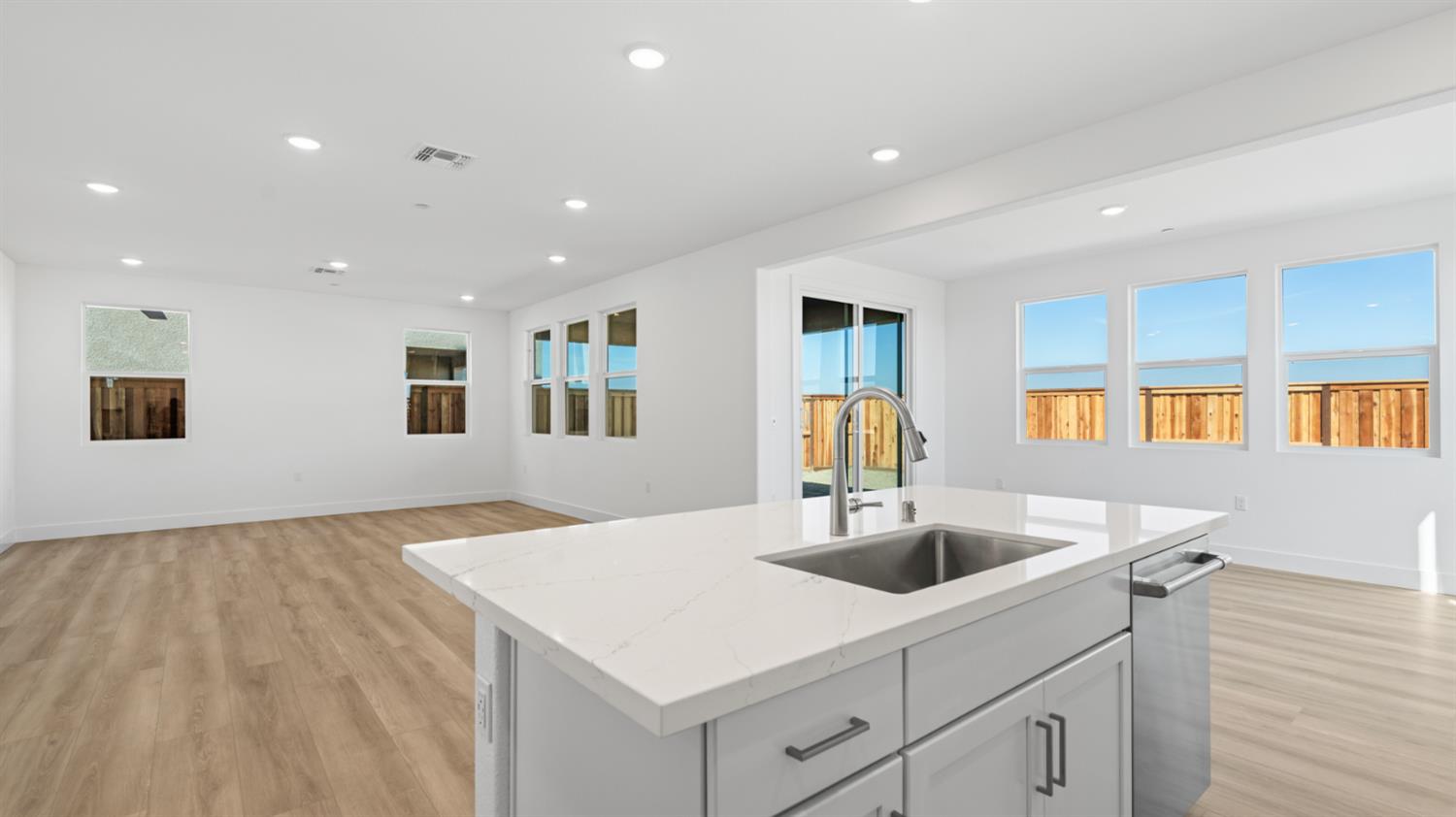787 Lorca Street Mountain House, CA 95391 - Photo 16 of 36 a kitchen with sink and center island