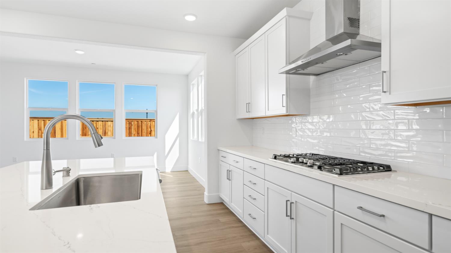 787 Lorca Street Mountain House, CA 95391 - Photo 17 of 36 a kitchen with stainless steel appliances a sink a stove and cabinets
