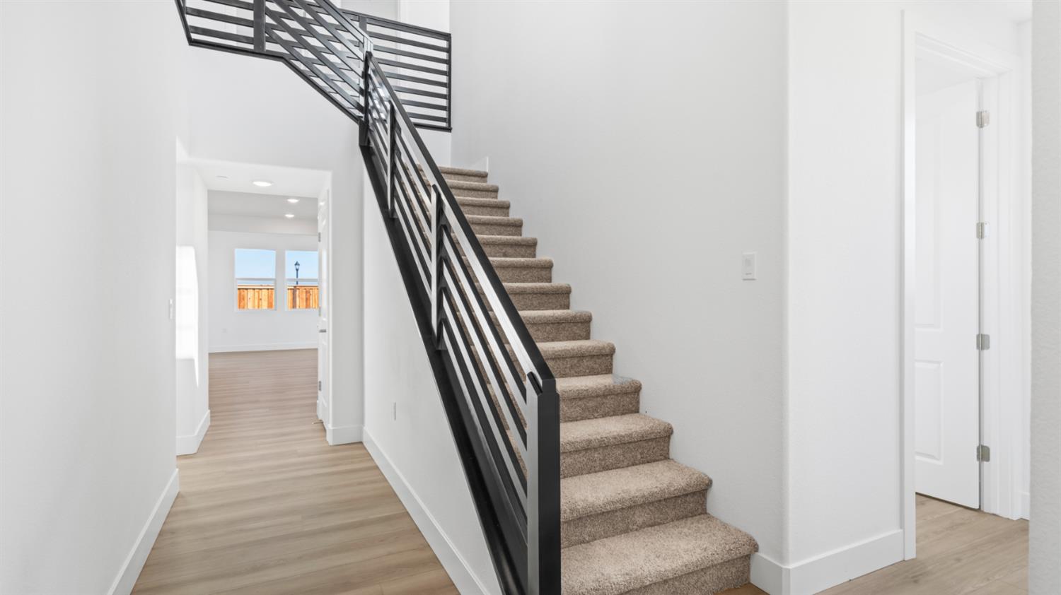 787 Lorca Street Mountain House, CA 95391 - Photo 4 of 36 a view of a hallway with wooden floor and entryway