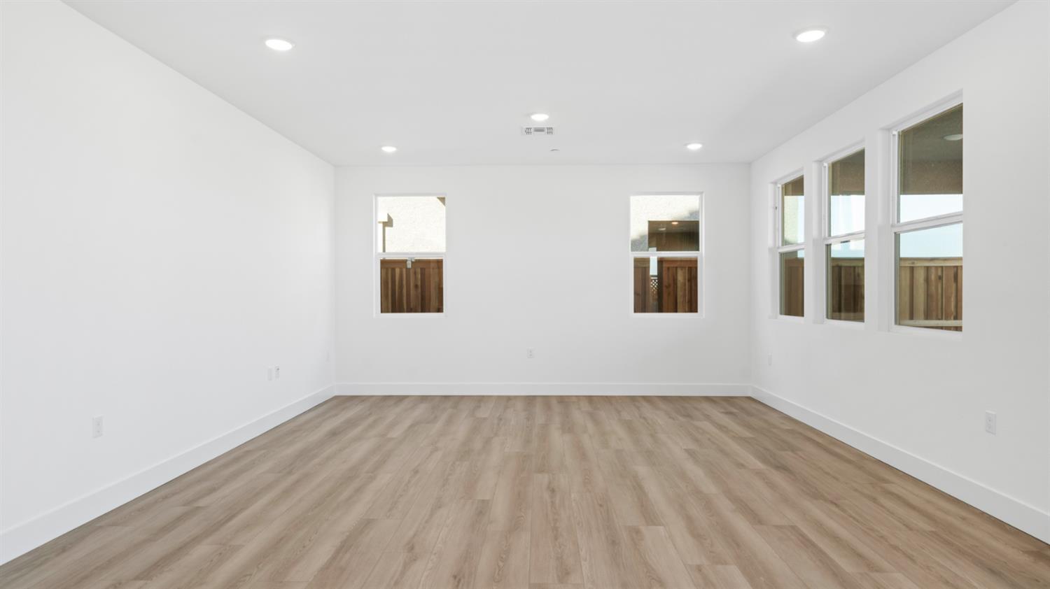 787 Lorca Street Mountain House, CA 95391 - Photo 9 of 36 a view of empty room with wooden floor and windows