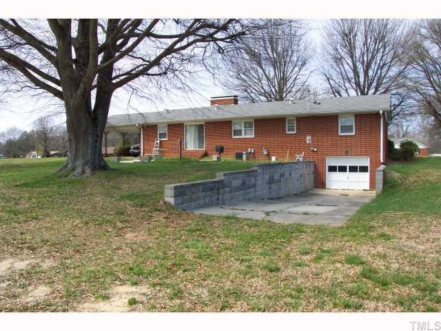 319 Sherron Road Durham, NC 27703 - Photo 2 of 6 front view of a house with a yard