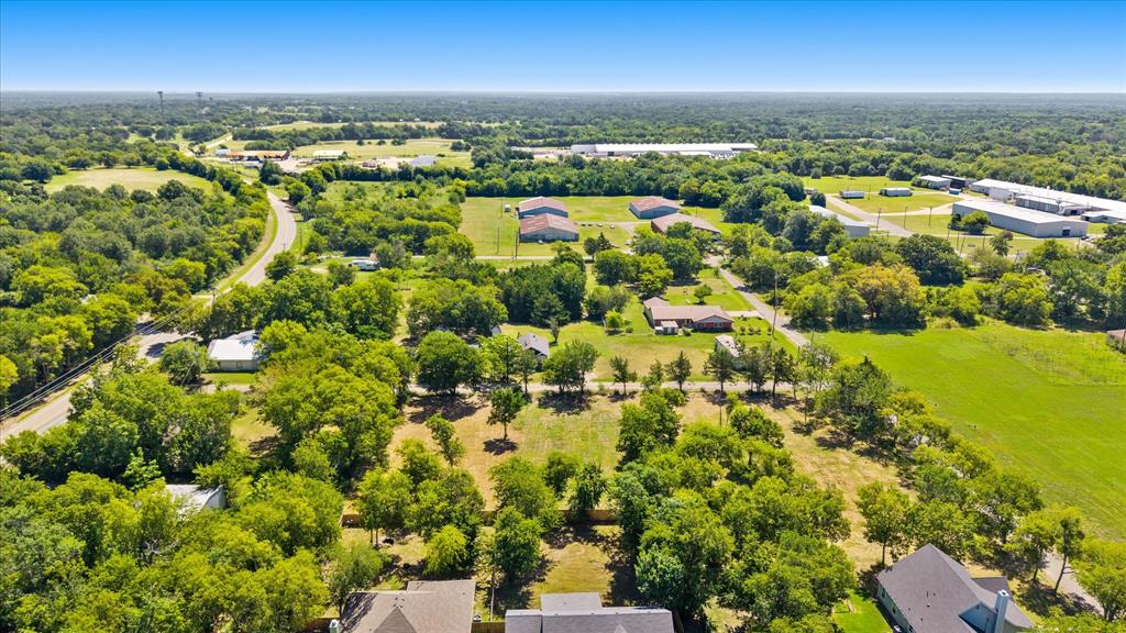 405 3rd Street Commerce, TX 75428 - Photo 18 of 26 an aerial view of residential houses with outdoor space