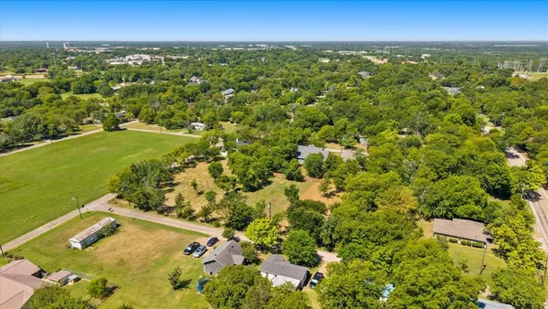 a view of a yard with trees