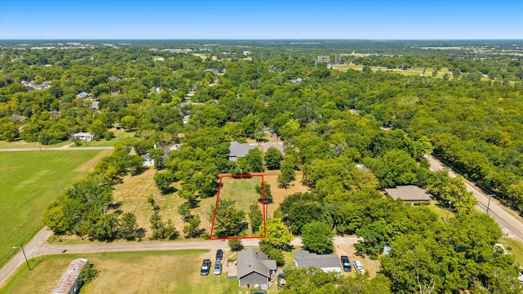 405 3rd Street Commerce, TX 75428 - Photo 4 of 26 an aerial view of residential houses with outdoor space