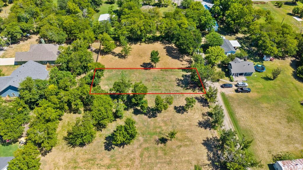 405 3rd Street Commerce, TX 75428 - Photo 5 of 26 an aerial view of residential houses with yard