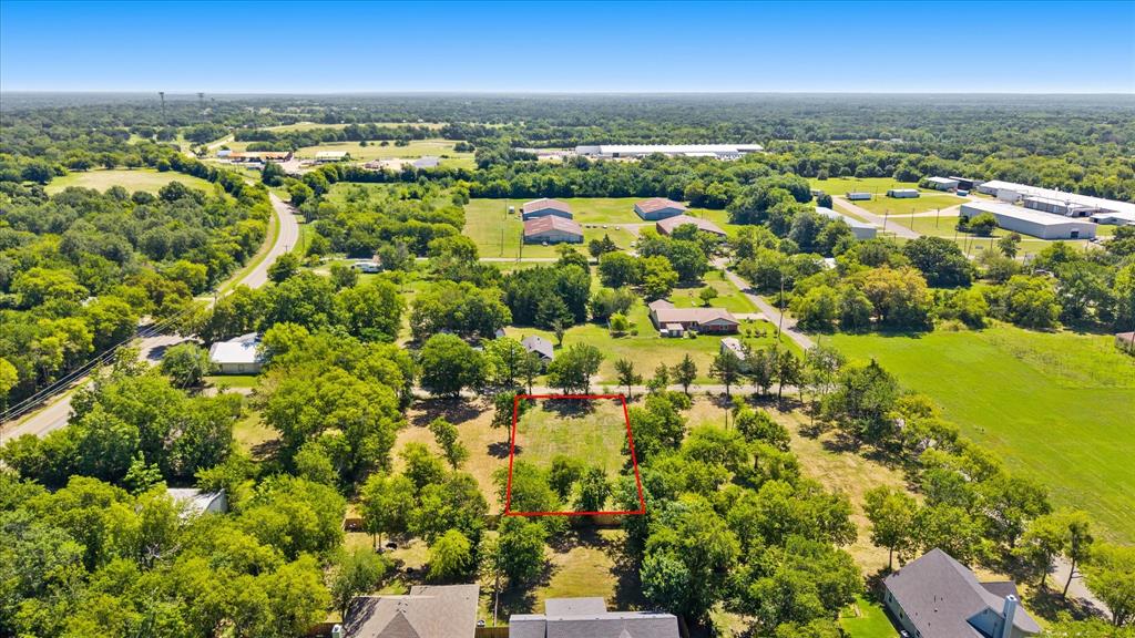 405 3rd Street Commerce, TX 75428 - Photo 8 of 26 an aerial view of residential houses with outdoor space