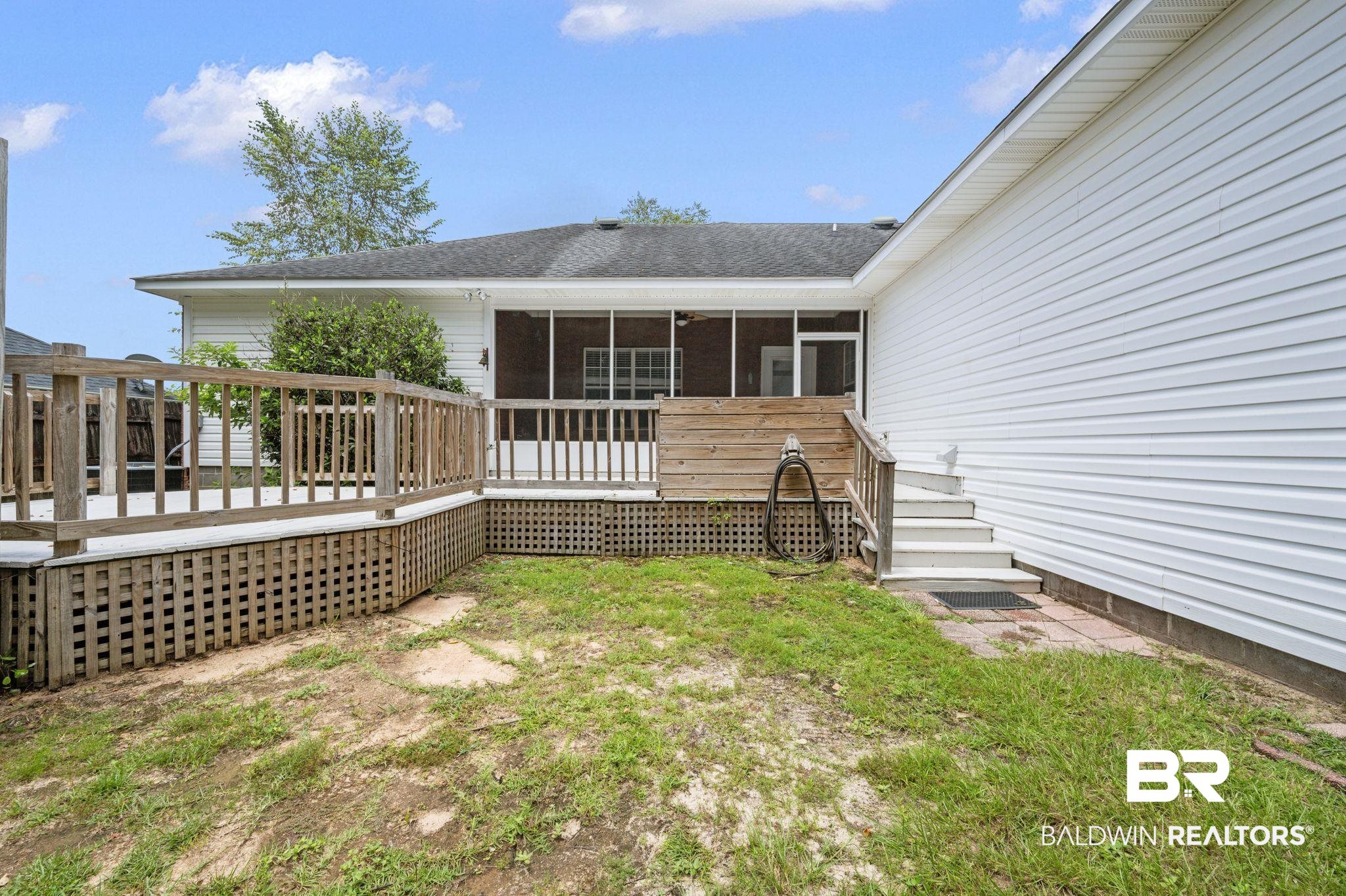2041 Ridgeline Drive Mobile, AL 36695 - Photo 34 of 43 Exterior space featuring a sunroom and a wooden deck