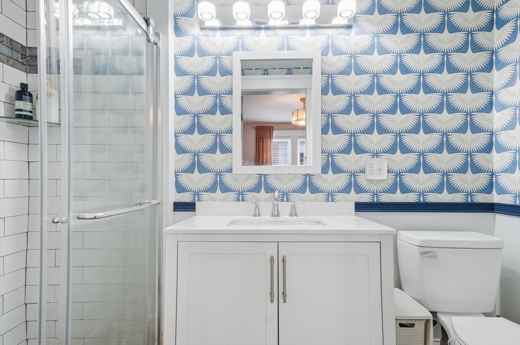 13 Roslyn Street, Unit 2 Salem, MA 01970 - Photo 14 of 26 a bathroom with a sink a toilet and shower