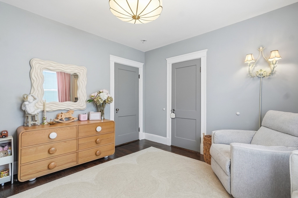 13 Roslyn Street, Unit 2 Salem, MA 01970 - Photo 18 of 26 a bedroom with a bed and a dresser