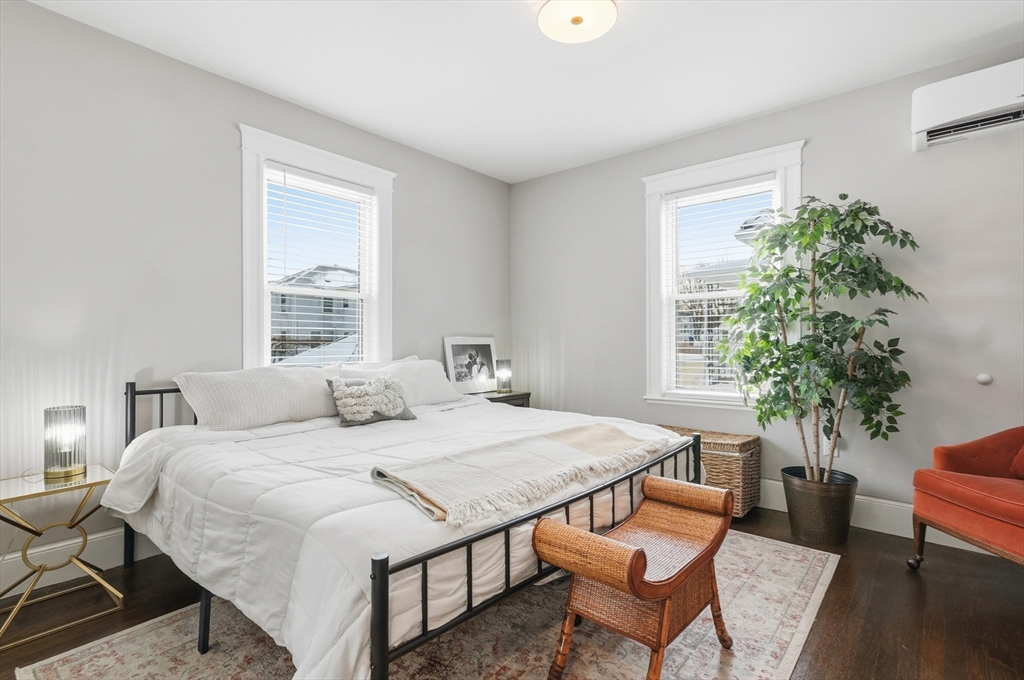 13 Roslyn Street, Unit 2 Salem, MA 01970 - Photo 19 of 26 a bedroom with a bed and a potted plant