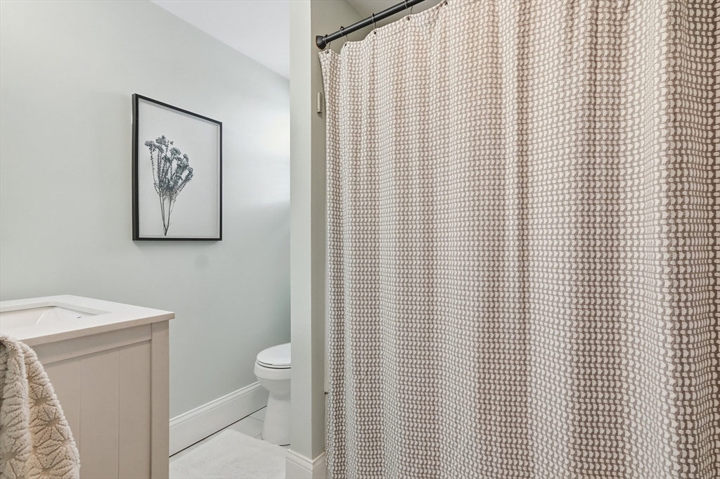 13 Roslyn Street, Unit 2 Salem, MA 01970 - Photo 20 of 26 a bathroom with a toilet and a sink