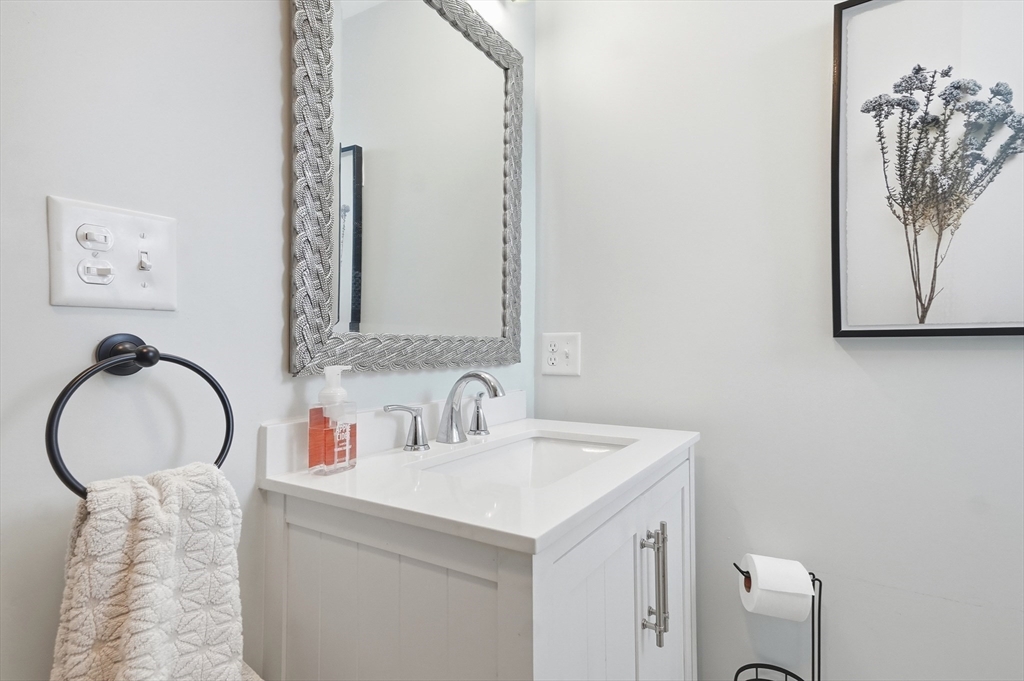 13 Roslyn Street, Unit 2 Salem, MA 01970 - Photo 21 of 26 a bathroom with a sink and a mirror