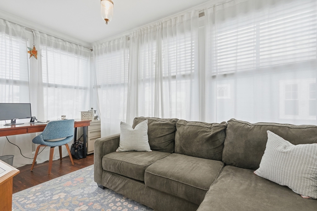 13 Roslyn Street, Unit 2 Salem, MA 01970 - Photo 22 of 26 a living room with furniture and a large window