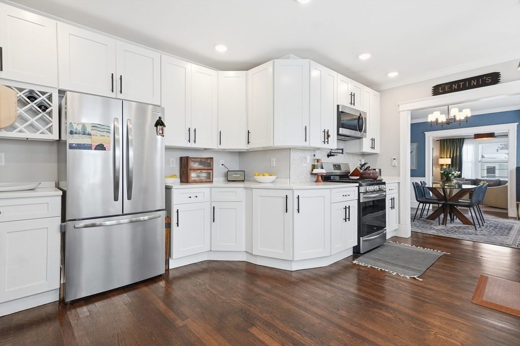13 Roslyn Street, Unit 2 Salem, MA 01970 - Photo 8 of 26 a kitchen with cabinets stainless steel appliances and wooden floor