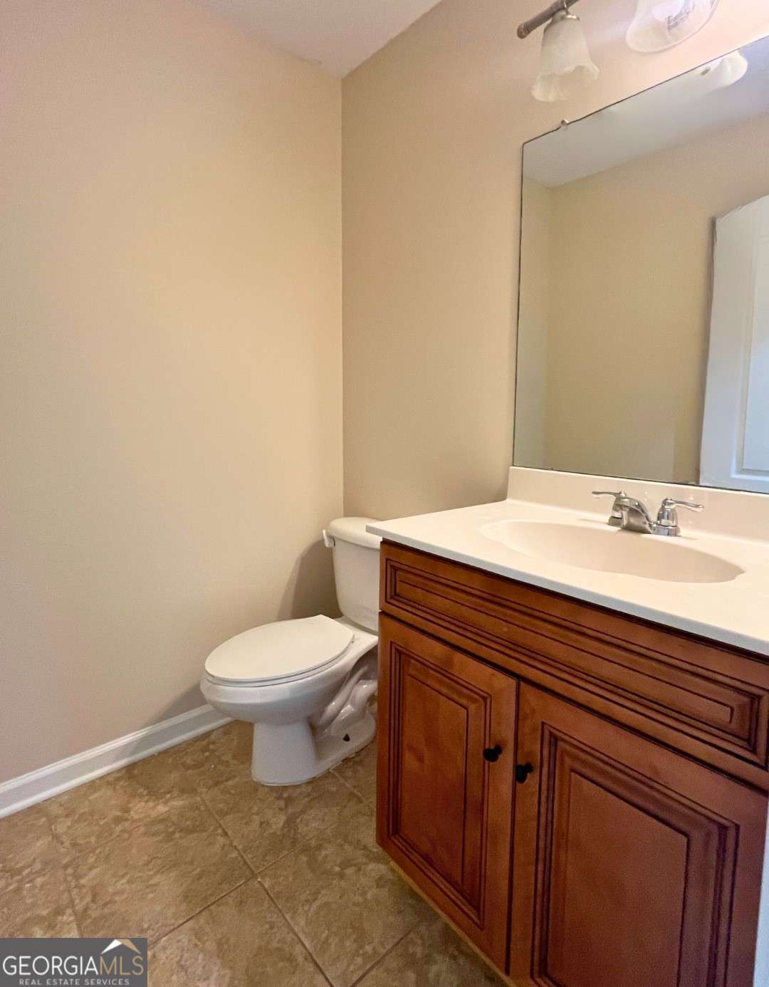 303 Gary Circle St. Marys, GA 31558 - Photo 14 of 42 a bathroom with a sink a toilet and mirror