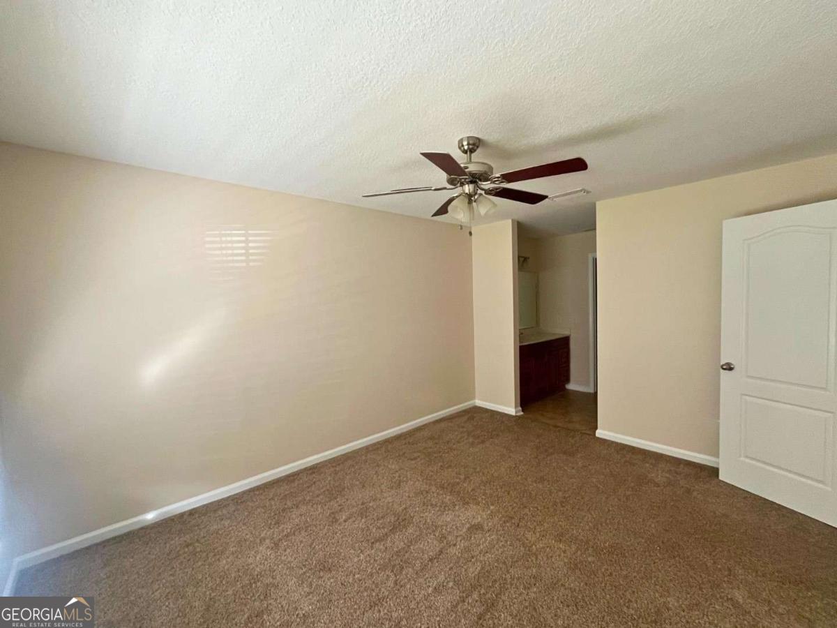 303 Gary Circle St. Marys, GA 31558 - Photo 16 of 42 a view of a room with a ceiling fan