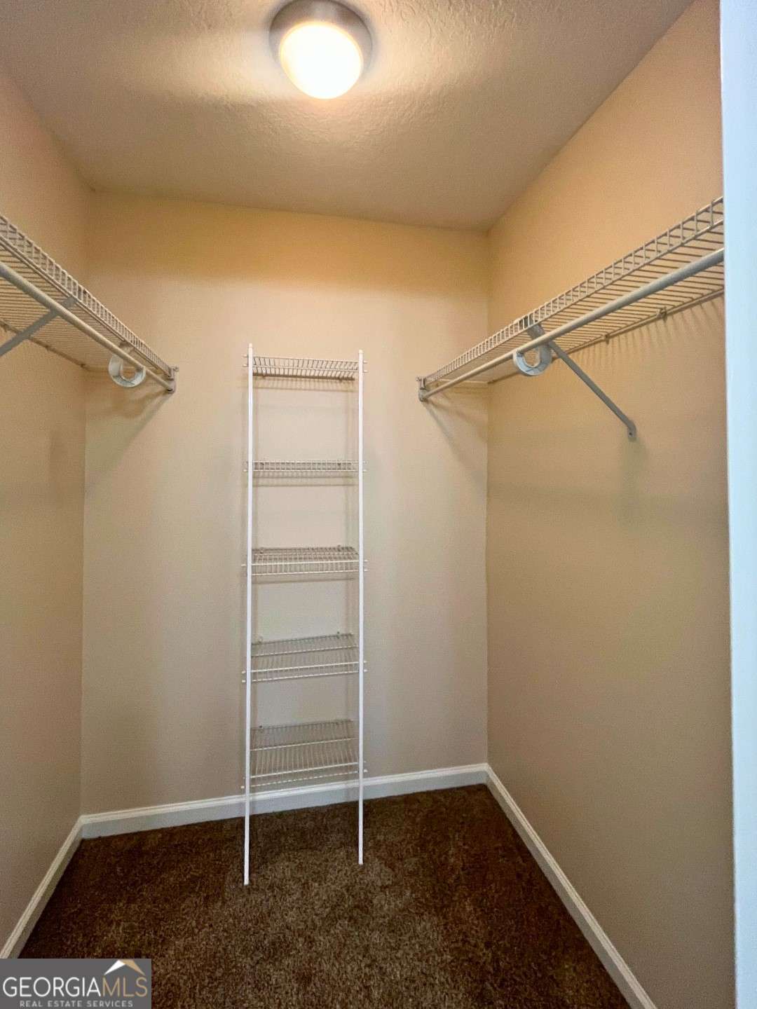 303 Gary Circle St. Marys, GA 31558 - Photo 18 of 42 a view of an empty walk in closet