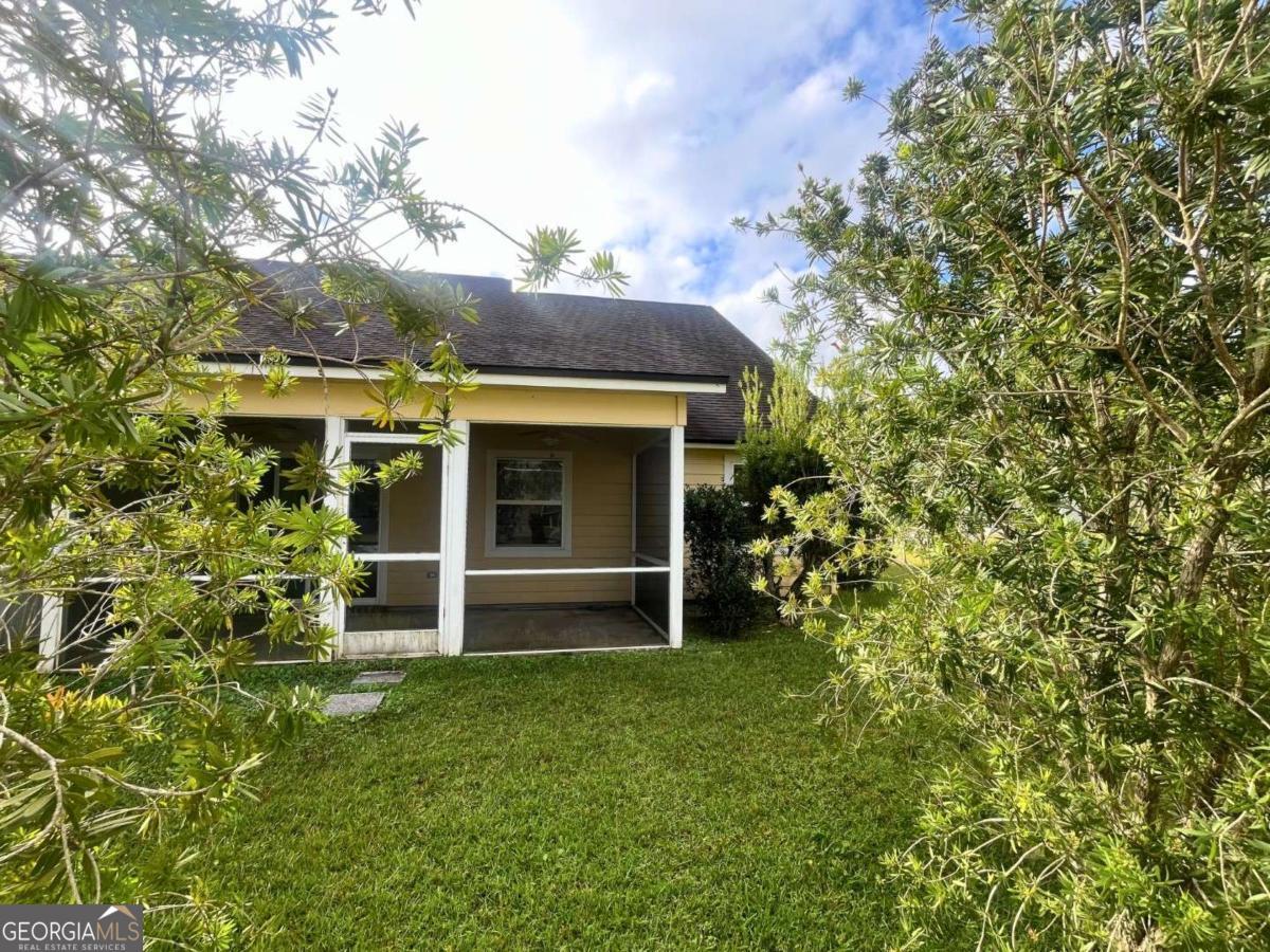 303 Gary Circle St. Marys, GA 31558 - Photo 34 of 42 front view of a house with a tree