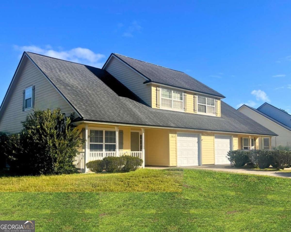 303 Gary Circle St. Marys, GA 31558 - Photo 39 of 42 a house view with a garden space