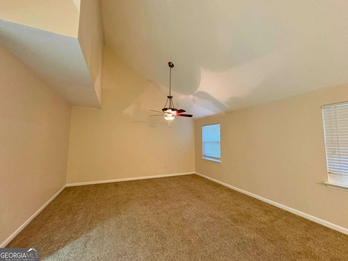 303 Gary Circle St. Marys, GA 31558 - Photo 5 of 42 a view of a room with window and ceiling fan