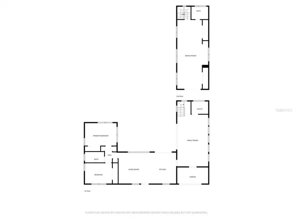 a kitchen with stainless steel appliances granite countertop a stove top oven a sink a refrigerator and white cabinets