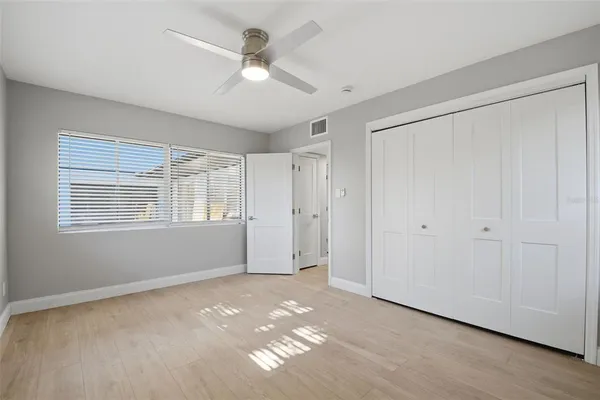 a view of an empty room with a closet