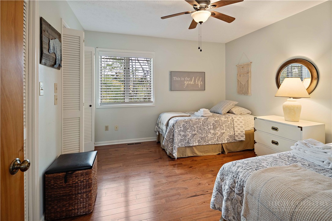 265 Leatherwood Road Banner Elk, NC 28604 - Photo 22 of 42 a bedroom with two beds and a window