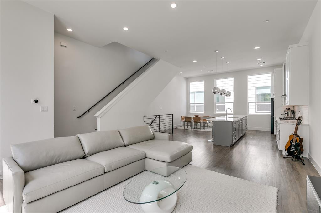 2908 Raleigh Street, Unit 204 Dallas, TX 75219 - Photo 18 of 25 a living room with furniture and a large window
