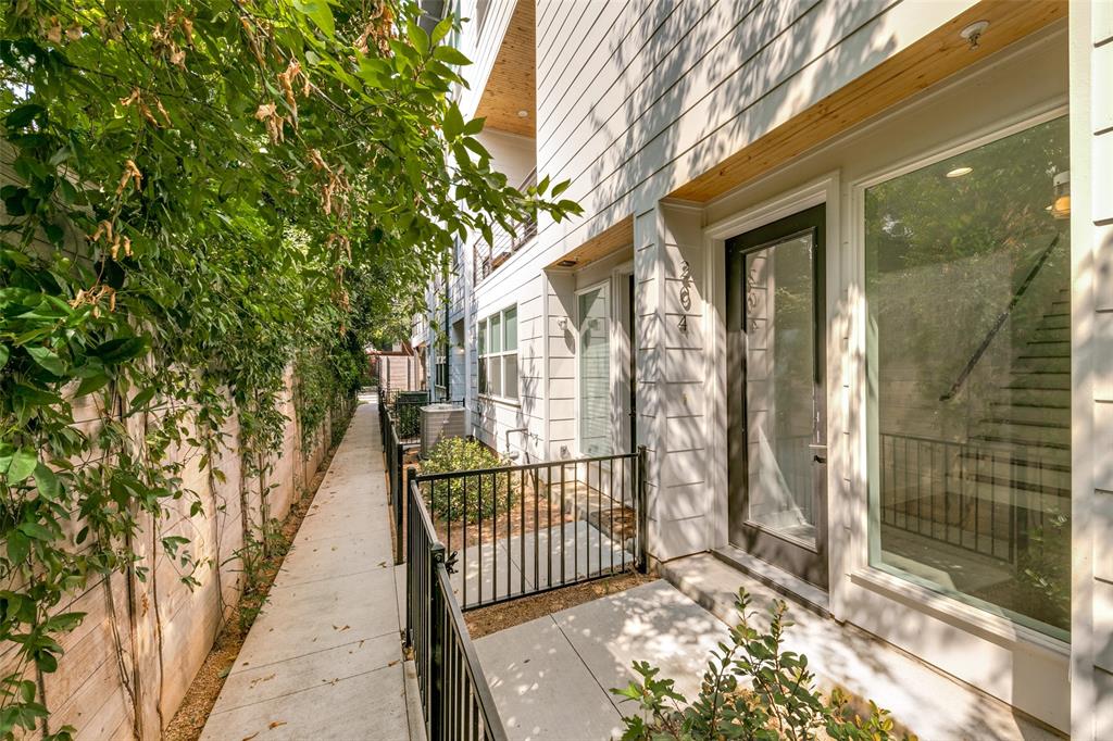 2908 Raleigh Street, Unit 204 Dallas, TX 75219 - Photo 3 of 25 a view of a porch with a small yard