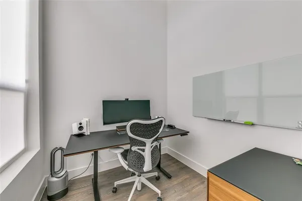 a view of a workspace with furniture