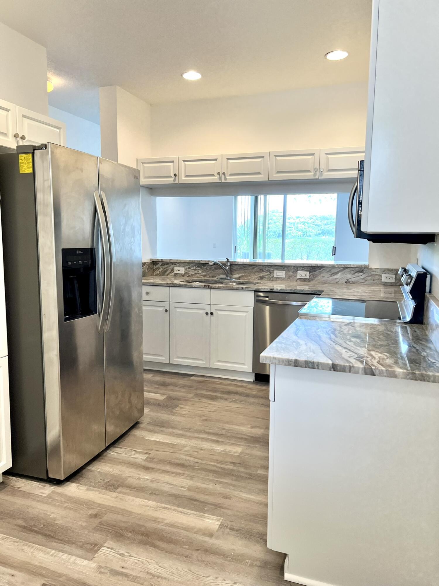 10253 Vía Hibiscus Boca Raton, FL 33428 - Photo 9 of 48 Updated kitchen