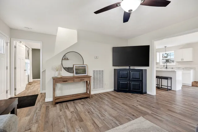 a living room with furniture and a flat screen tv