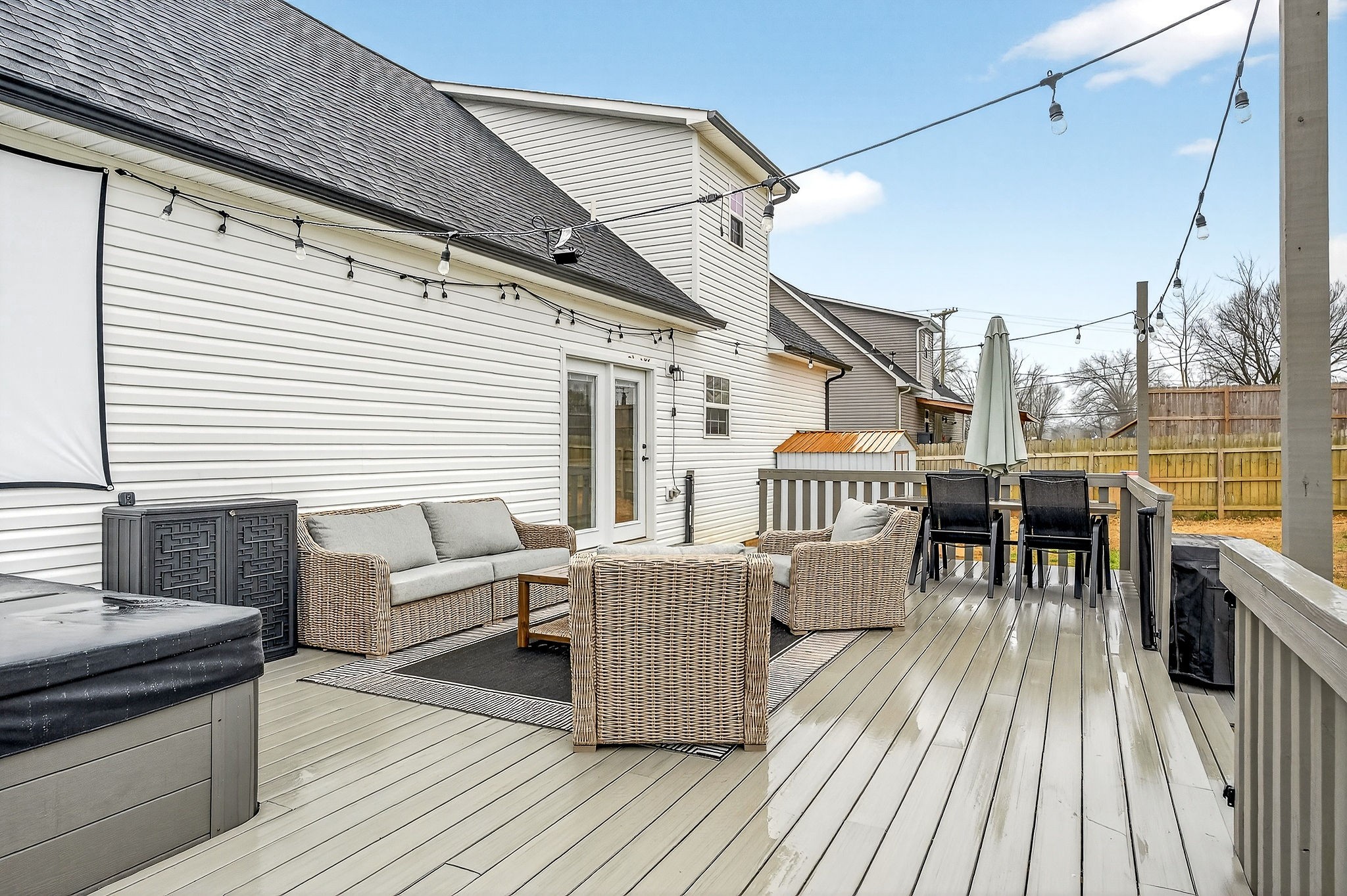217 Peach Street Baxter, TN 38544 - Photo 32 of 39 a view of a roof deck with table and chairs wooden floor and fence