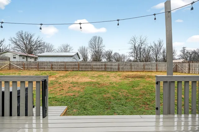 a view of a house with backyard porch and roof