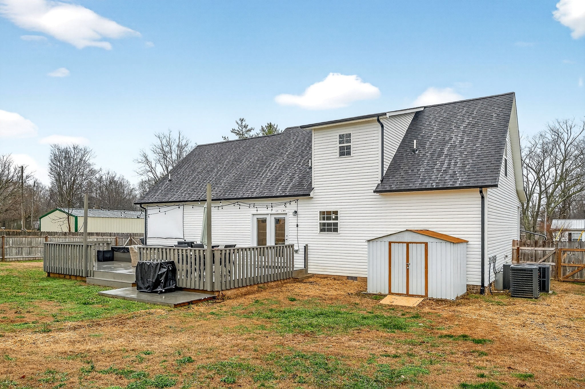 217 Peach Street Baxter, TN 38544 - Photo 35 of 39 a view of a house with backyard porch and roof