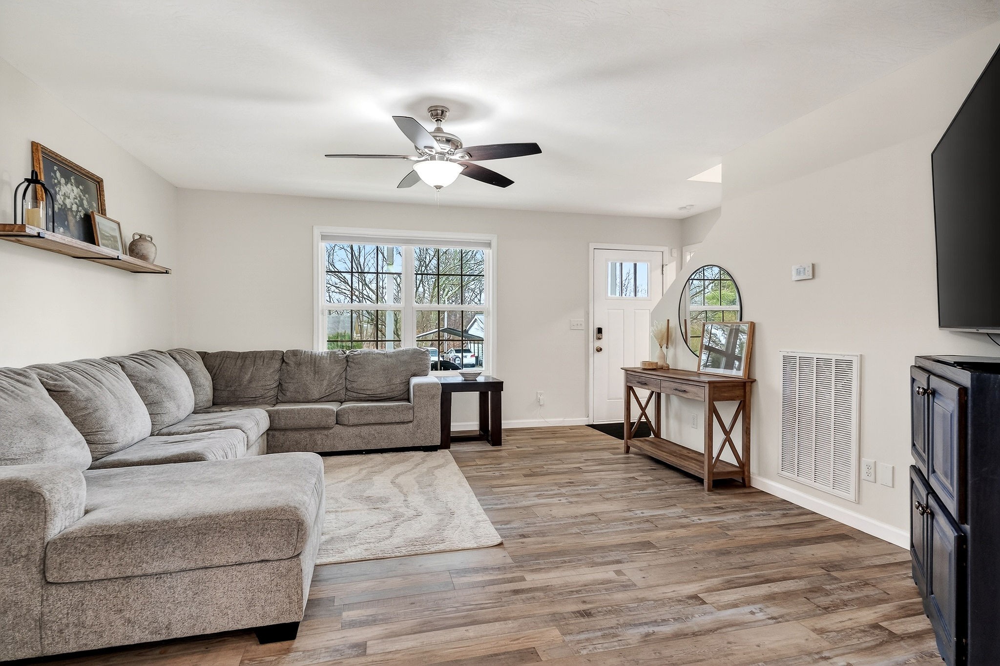 217 Peach Street Baxter, TN 38544 - Photo 4 of 39 a living room with furniture and a flat screen tv