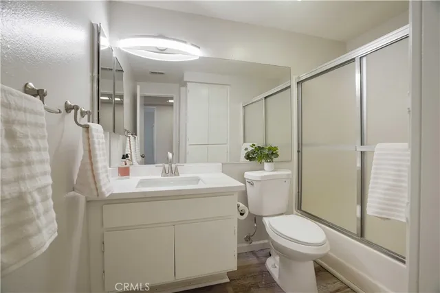 a close view of a utility room with dryer and washer