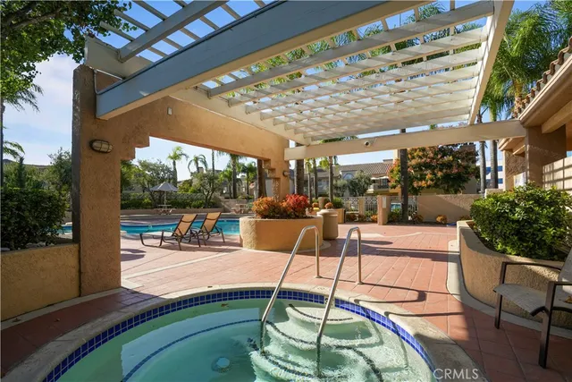 a patio with a table and chairs