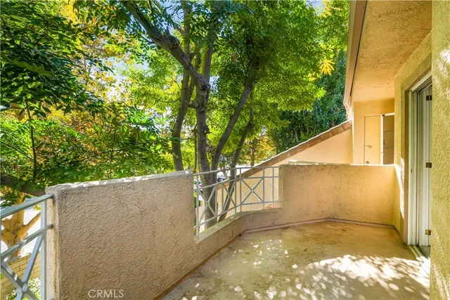 a view of a house with a tree
