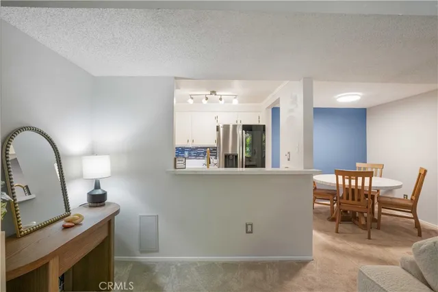 a view of a dining room with furniture and window