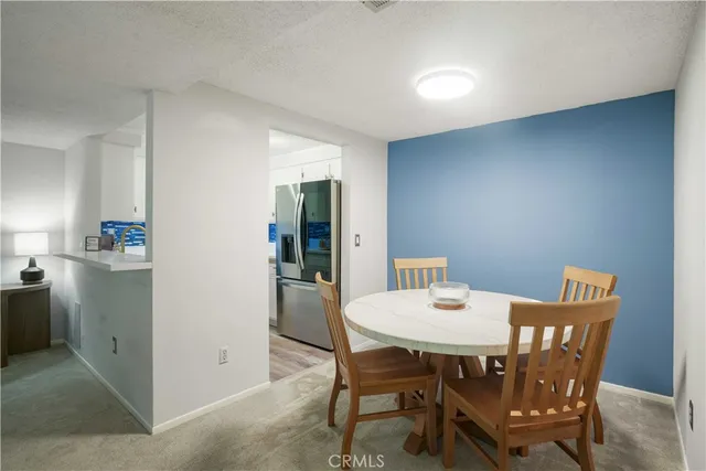 a kitchen with stainless steel appliances a refrigerator sink and stove