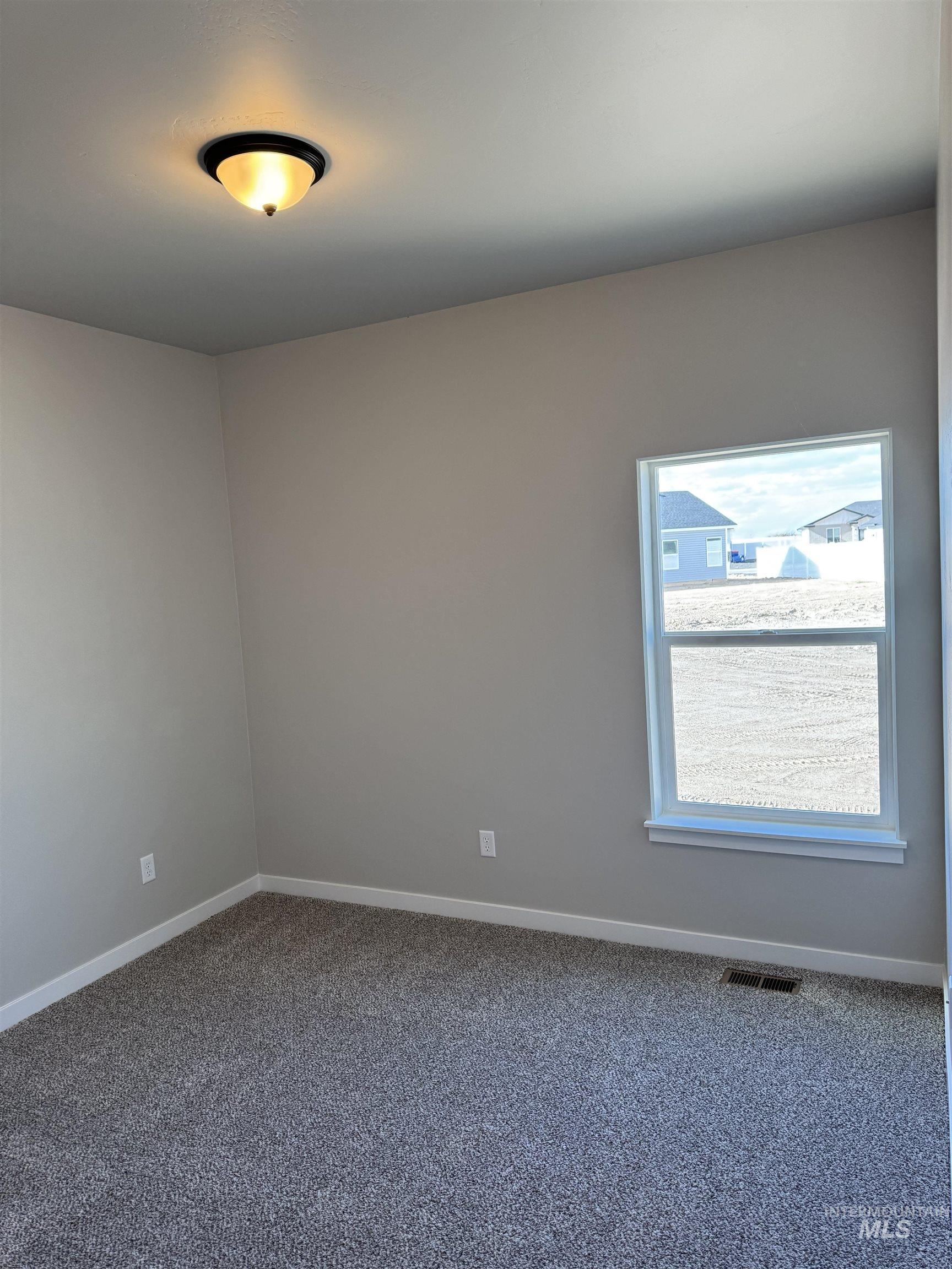 2064 Harrison Street South Twin Falls, ID 83301 - Photo 19 of 29 Empty room with carpet