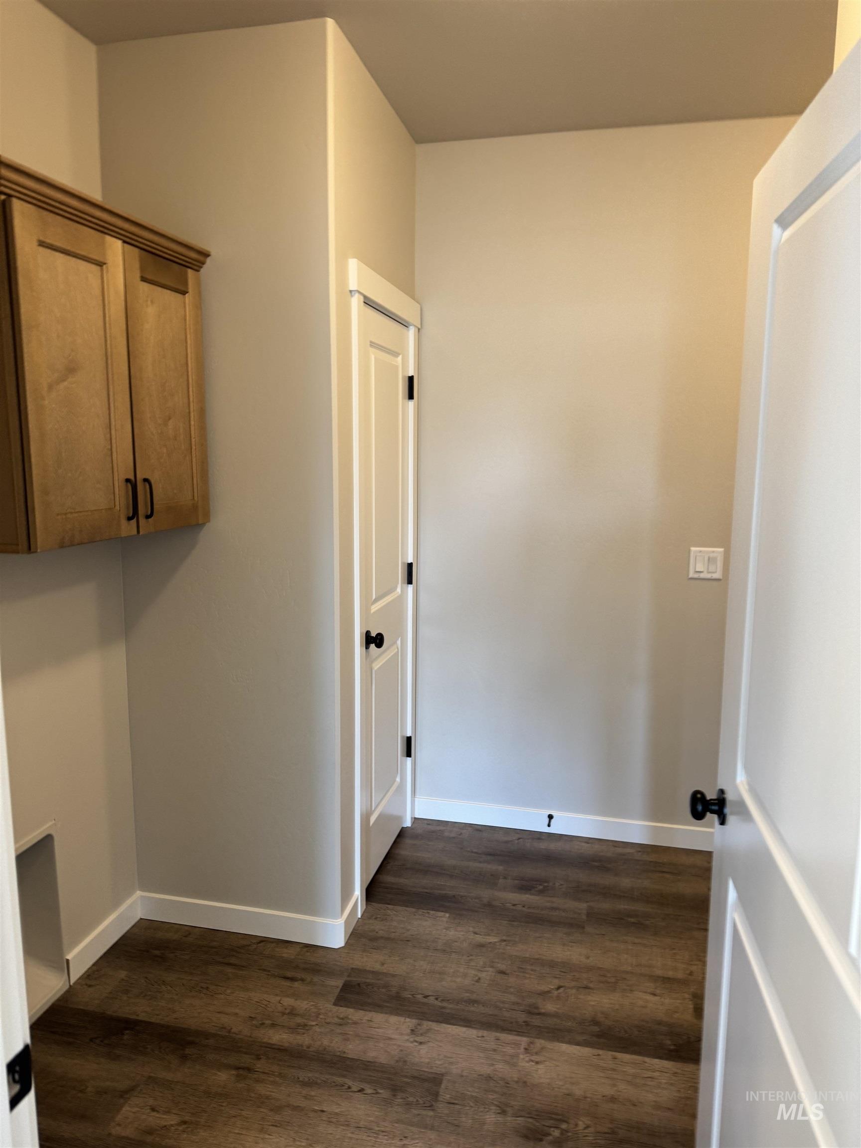 2064 Harrison Street South Twin Falls, ID 83301 - Photo 8 of 29 Laundry room featuring baseboards and dark wood-style floors