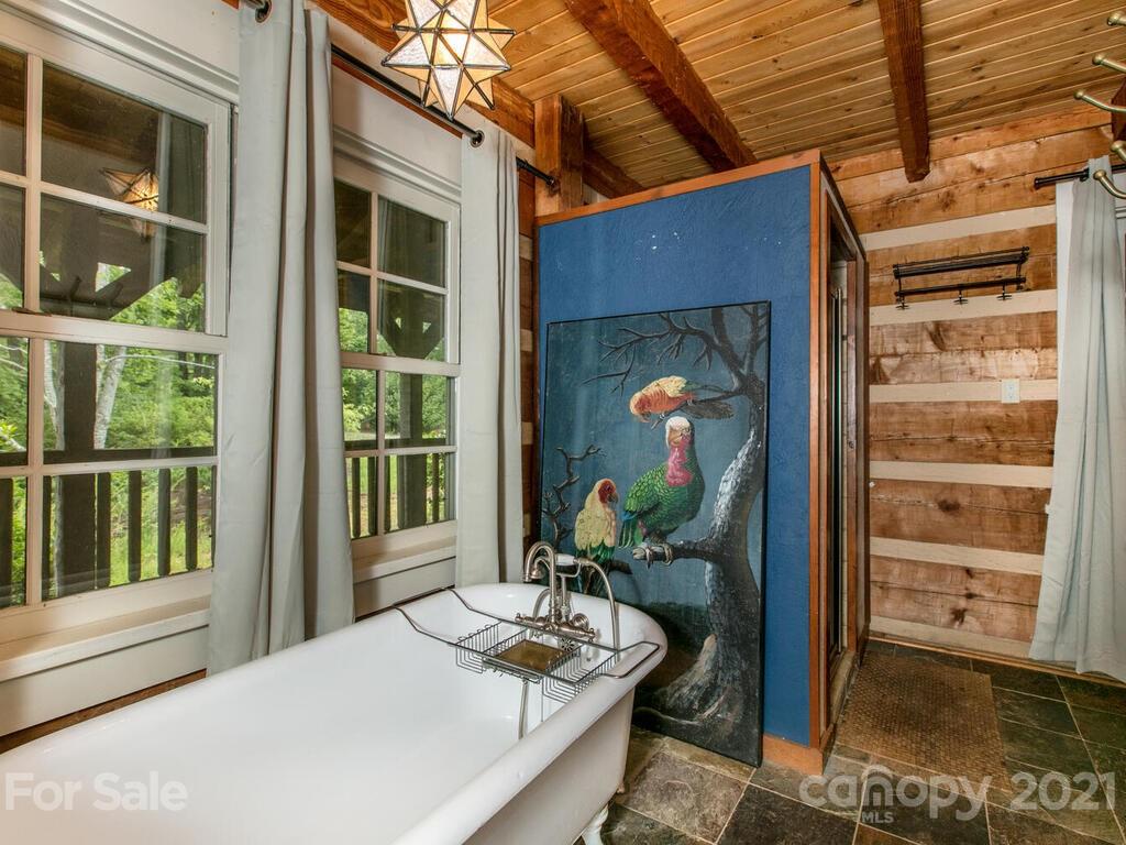 723 North Highland Road, Unit 9 10 11 Mill Spring, NC 28756 - Photo 16 of 46 a balcony with table and chairs