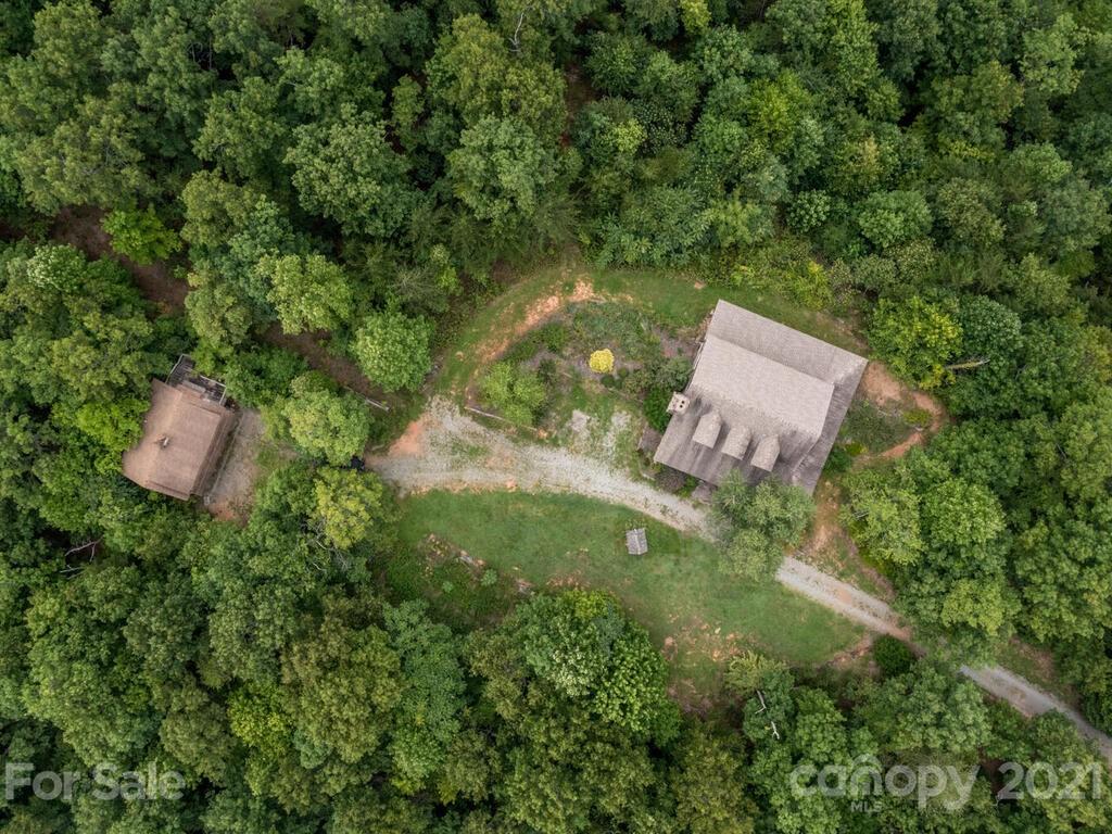 723 North Highland Road, Unit 9 10 11 Mill Spring, NC 28756 - Photo 18 of 46 an aerial view of a house with a yard