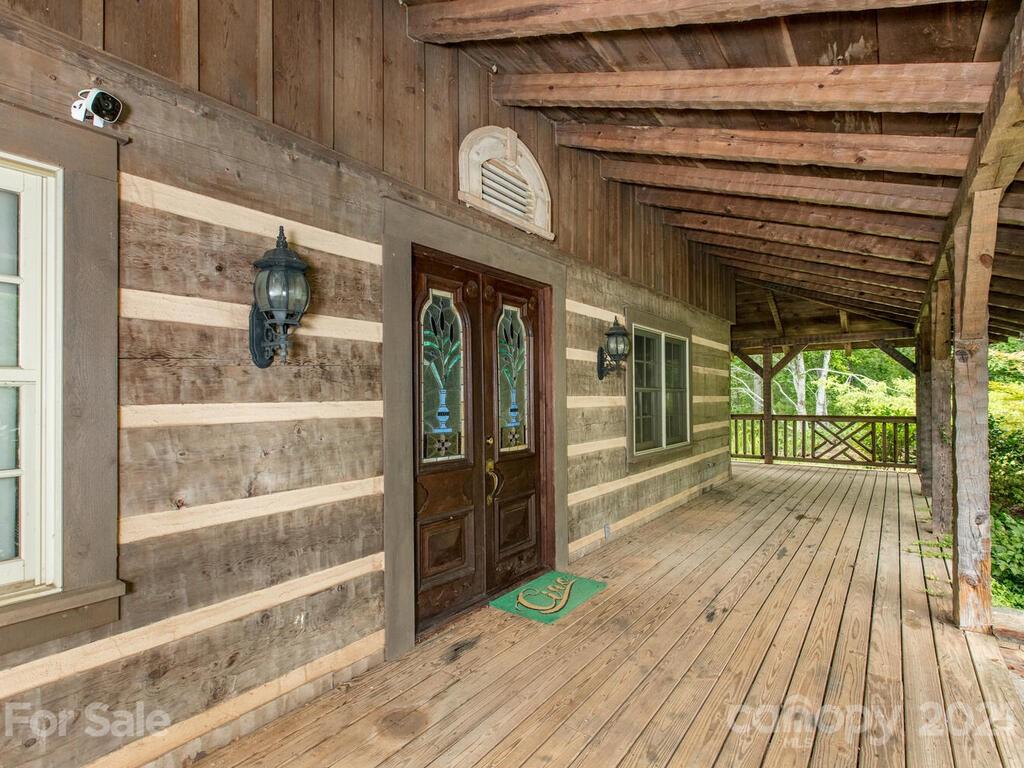 723 North Highland Road, Unit 9 10 11 Mill Spring, NC 28756 - Photo 19 of 46 a view of a porch of the house