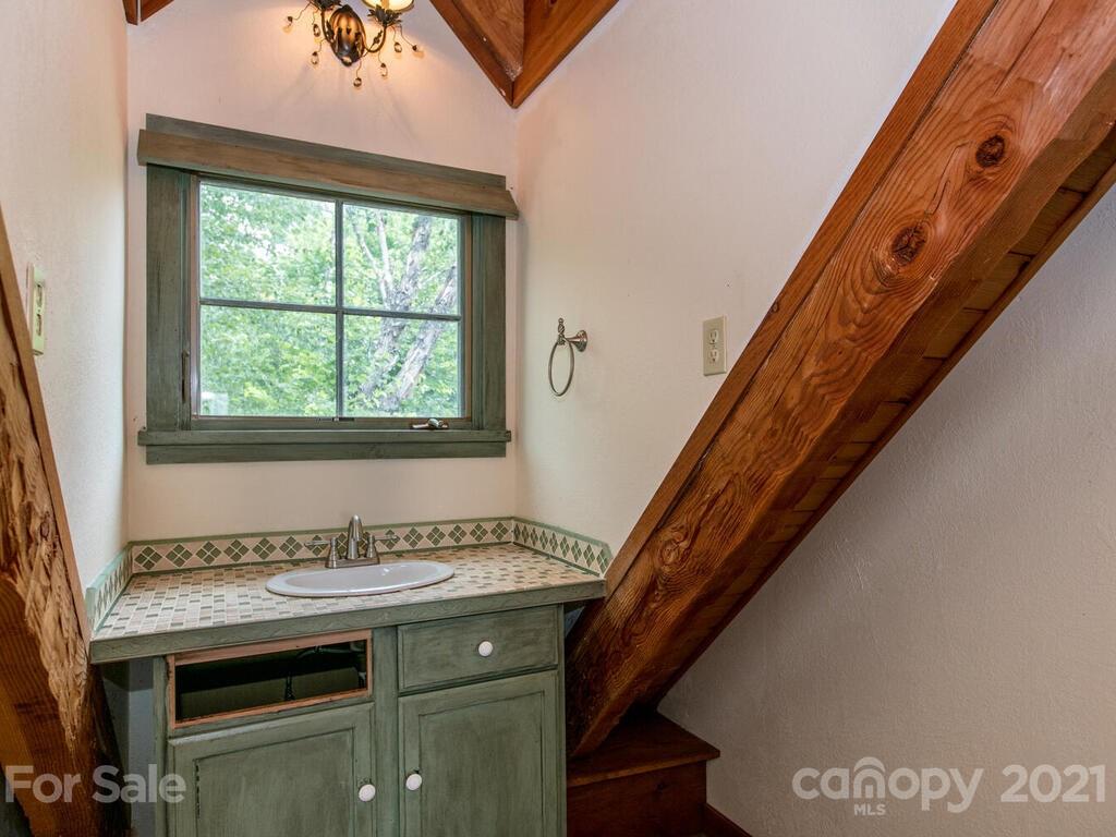 723 North Highland Road, Unit 9 10 11 Mill Spring, NC 28756 - Photo 24 of 46 a view of a hallway with washer and dryer